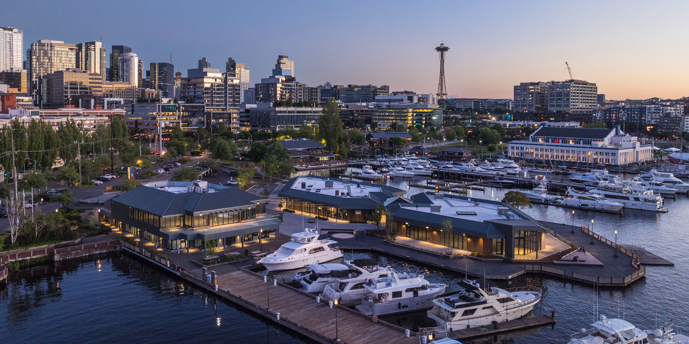 lake union piers and seattle skyline at dusk