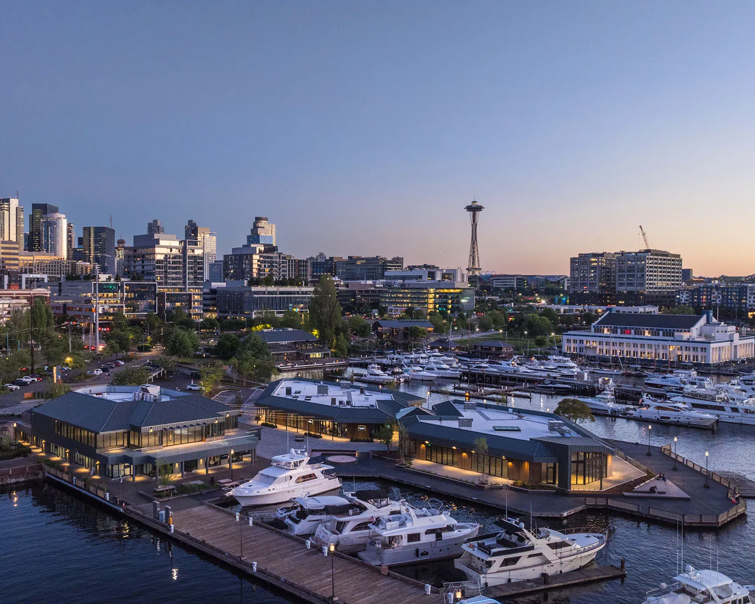 lake union piers and seattle skyline at dusk