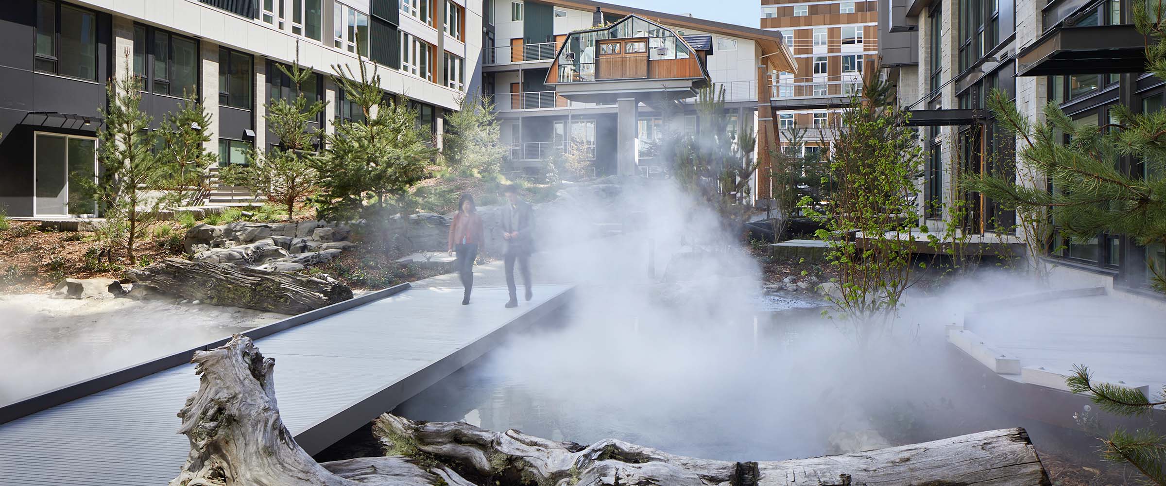 People walking through Sitka courtyard